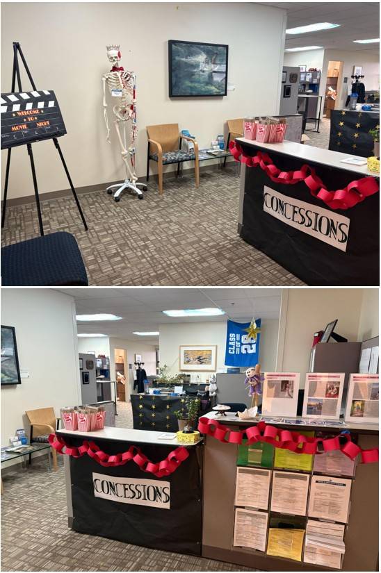 Front desk is turned into a concessions stand with popcorn buckets, candy and red ribbons. There is also a film reel decoration in the front office
